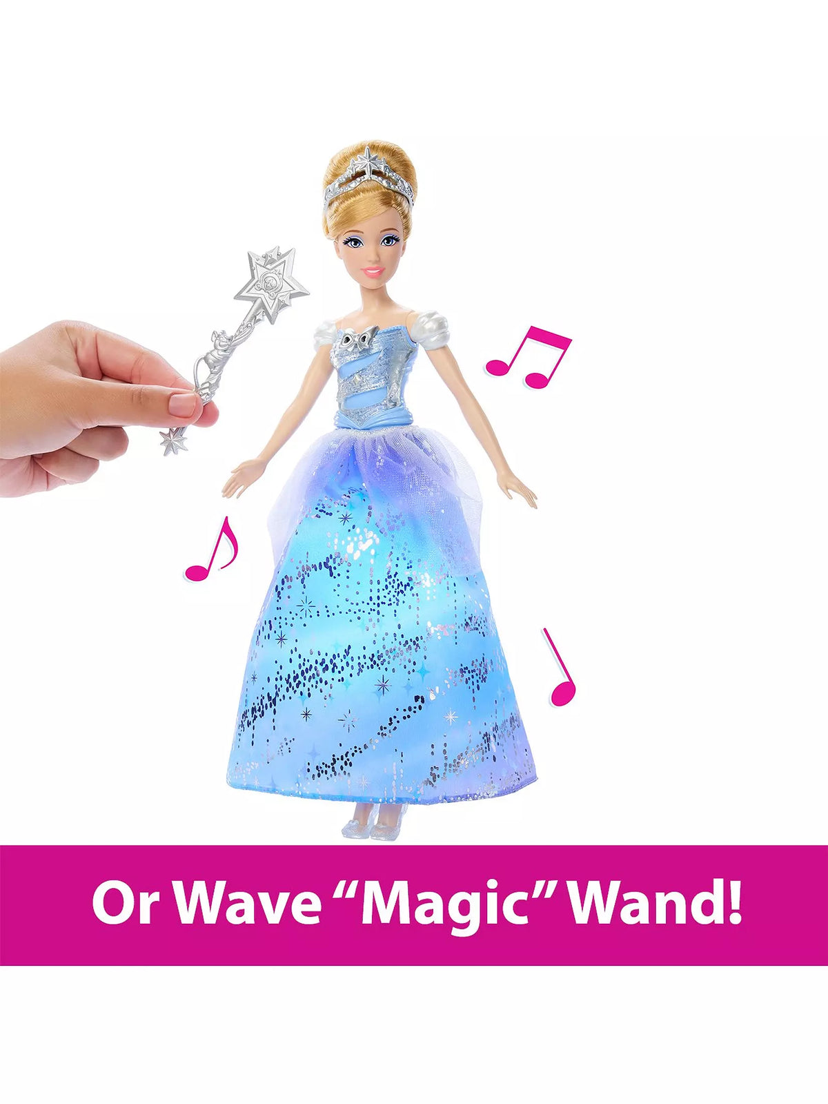 hand waving wand over doll in blue dress to make music start 