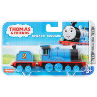 blue and red train engine on white background in packaging 