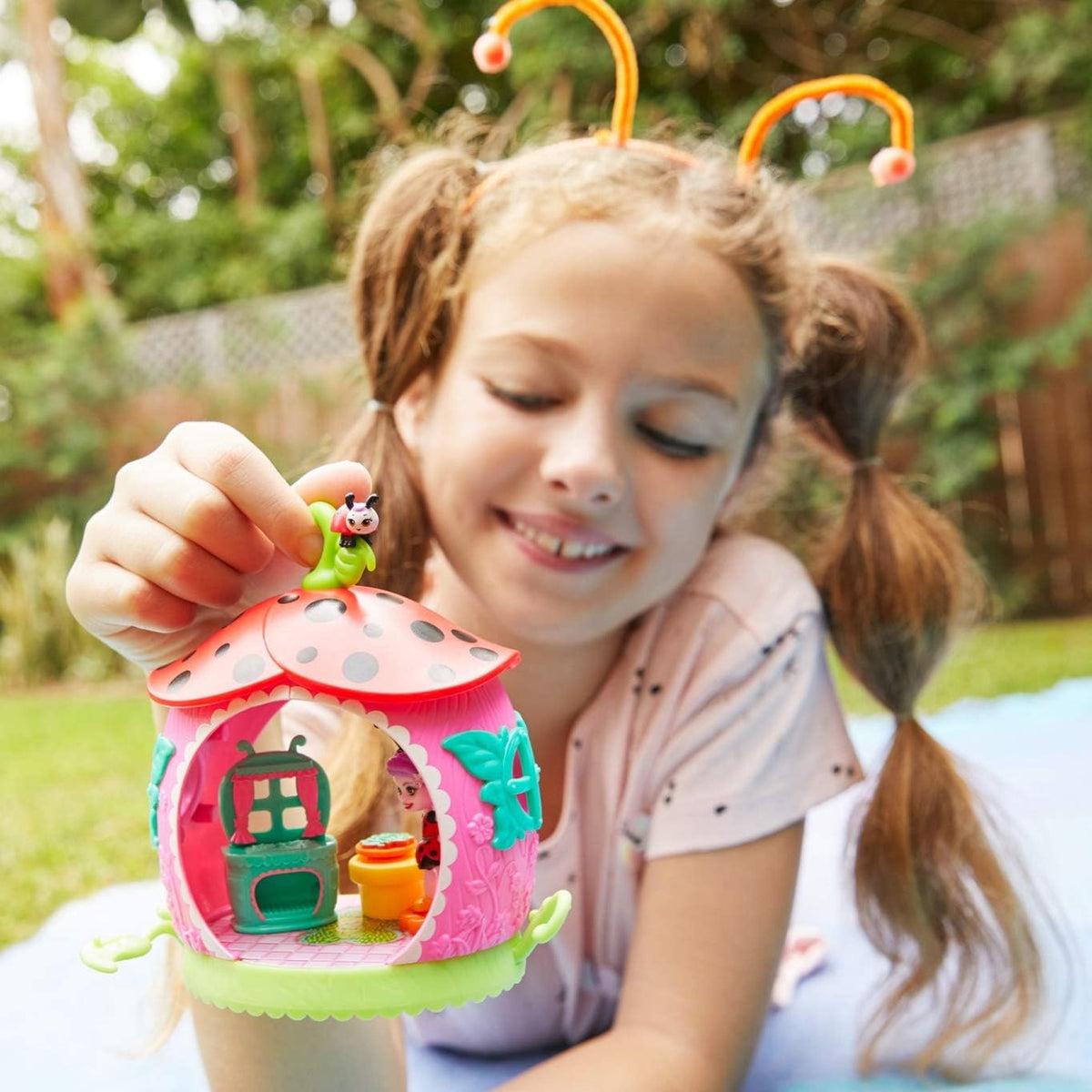girl playing with animals mini kitchen 