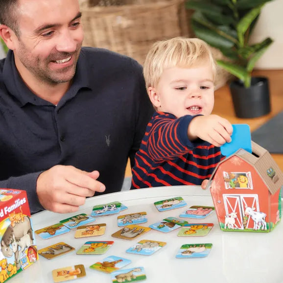child and parent playing farmyard families game