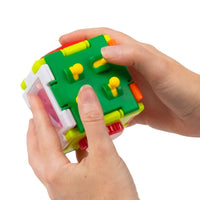 hands holding green fidget square 