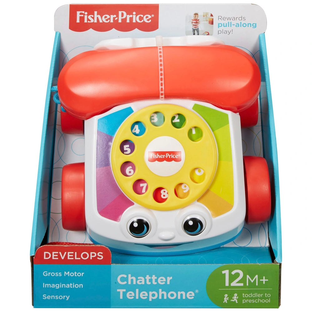 colourful children's rotary phone in packaging on white background 