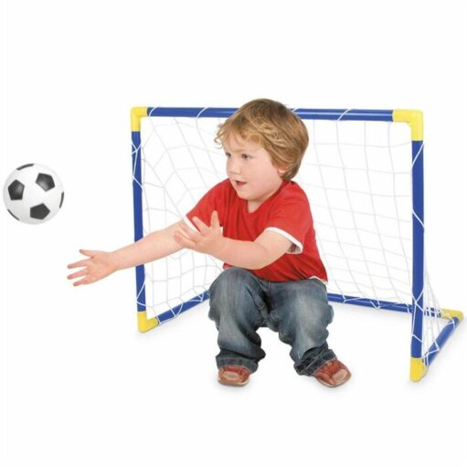 boy playing with goal and ball 