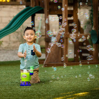 child playing outside with bubble playset