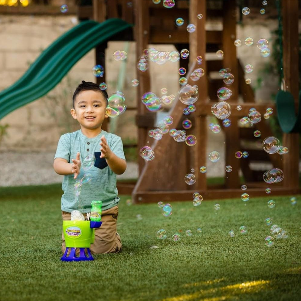 child playing outside with bubble playset