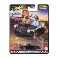 black and red model car in packaging on white background 