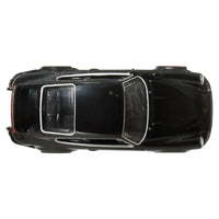 top of black and white model car on white background 