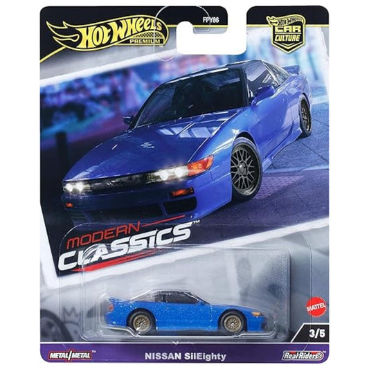 bright blue model car in blister packaging on white background