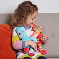 girl holding plush toys 