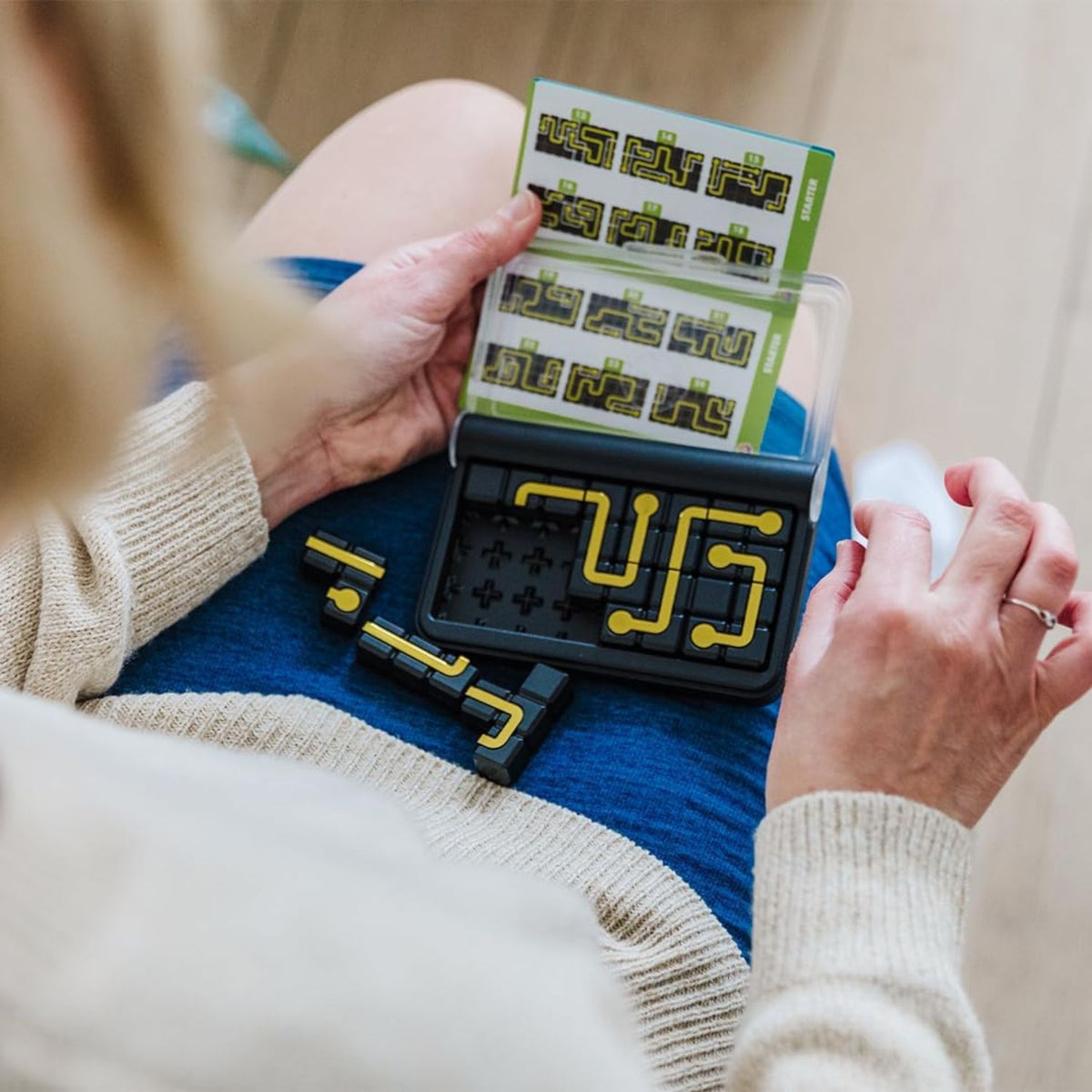 person playing with iq circuit game 