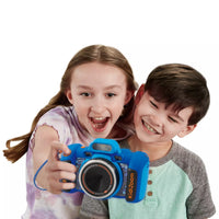 young girl and boy taking a picture with dark blue kids camera 