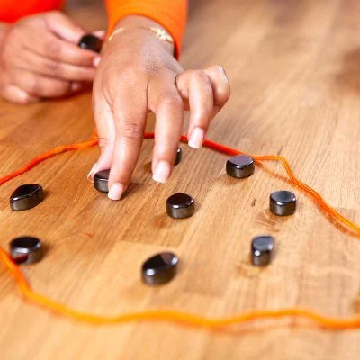 hand playing kluster game 