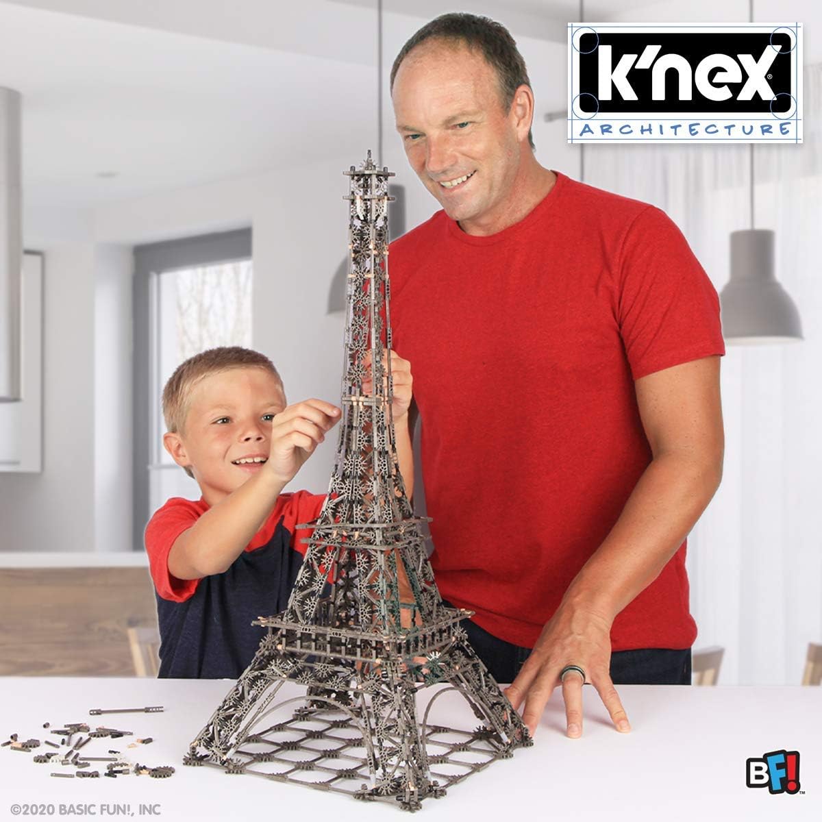 man and boy building knex eiffel tower