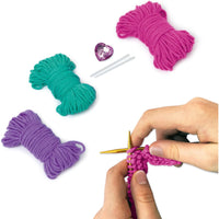 hands knitting with contents pictured 