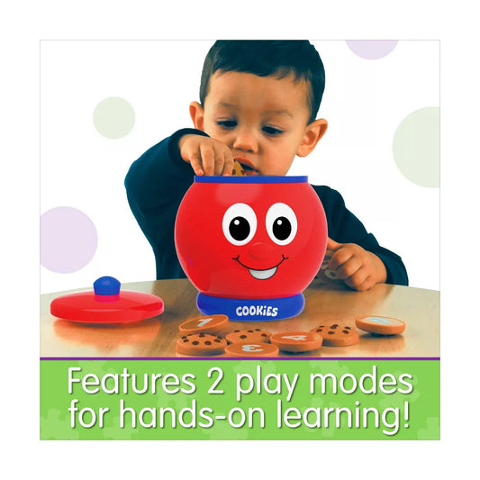 child putting cookies in cookie jar 