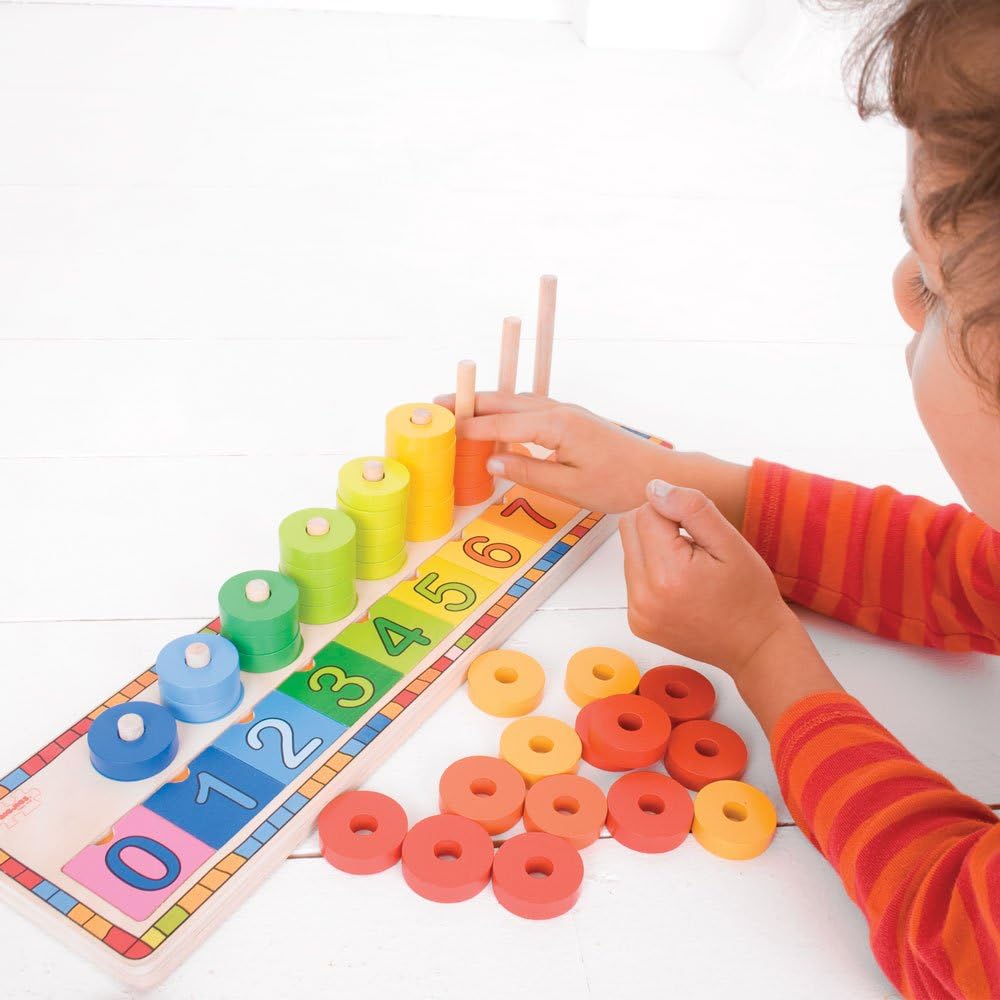 toddler stacking wooden disks on wooden counting toys 