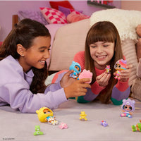 girls playing with carebear dolls 