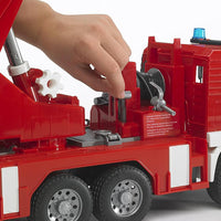 close up of hand playing with fire engine 