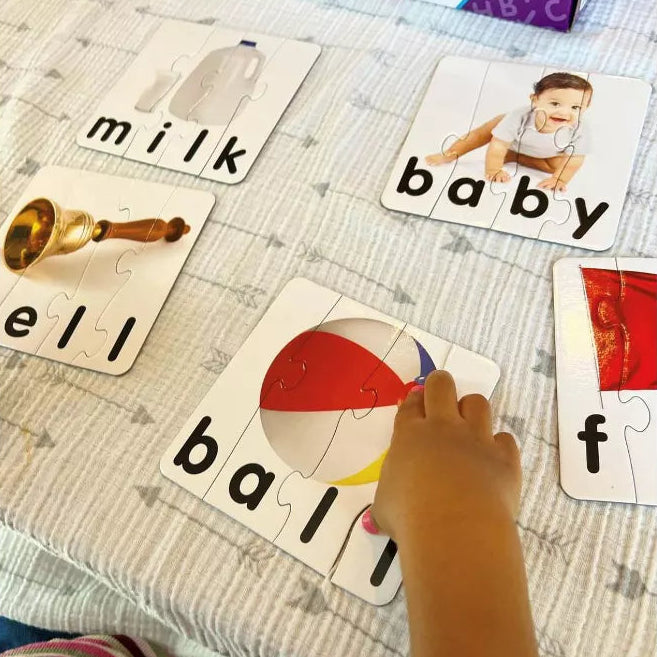 small hand playing with spelling game 