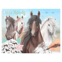 horse colouring book cover with hand holding a pencil 