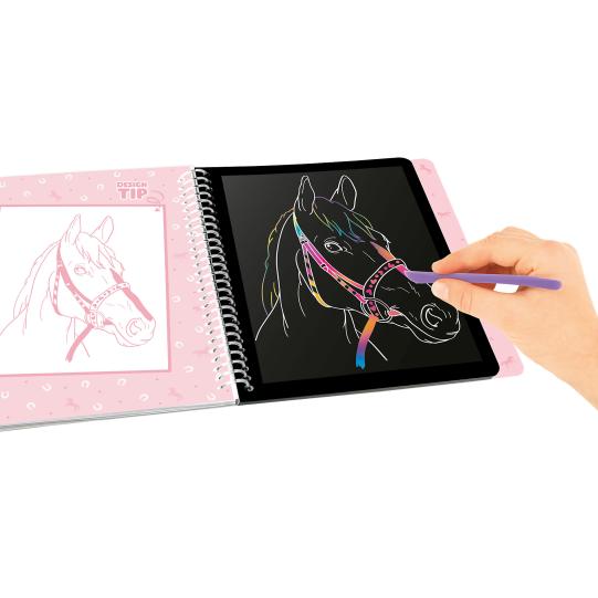 hand drawing on open page of scratch book 