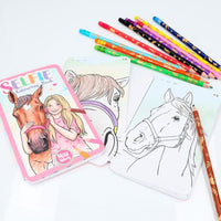 miss melody selfie colouring book opened with pencils 