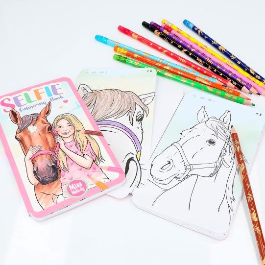 miss melody selfie colouring book opened with pencils 