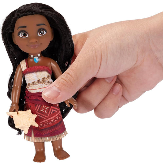 hand holding disney moana doll 
