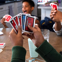 hand holding monopoly bid cards