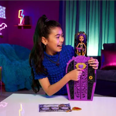 girl smiling and playing with wolf girl doll and purple wardrobe 