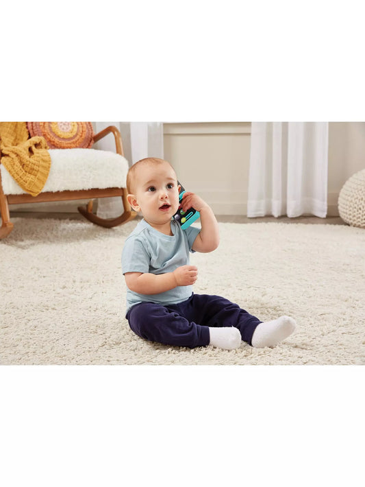 baby boy holding baby phone 