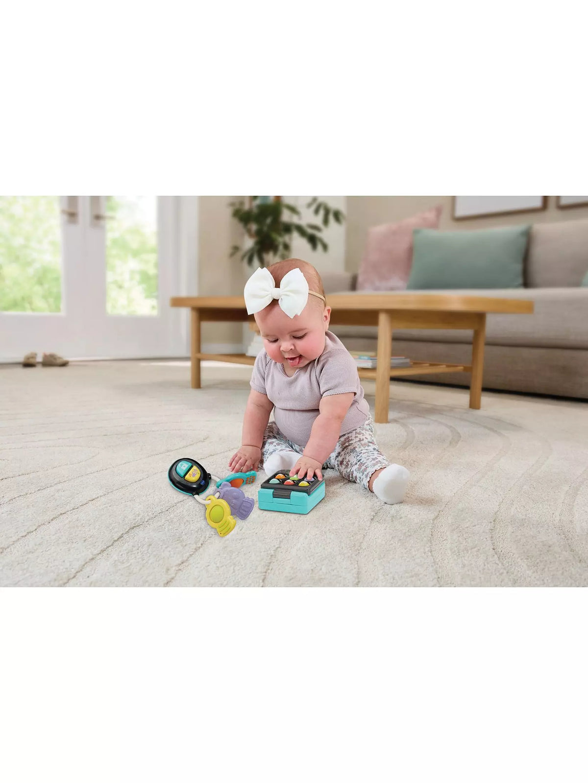 baby girl playing with baby phone 