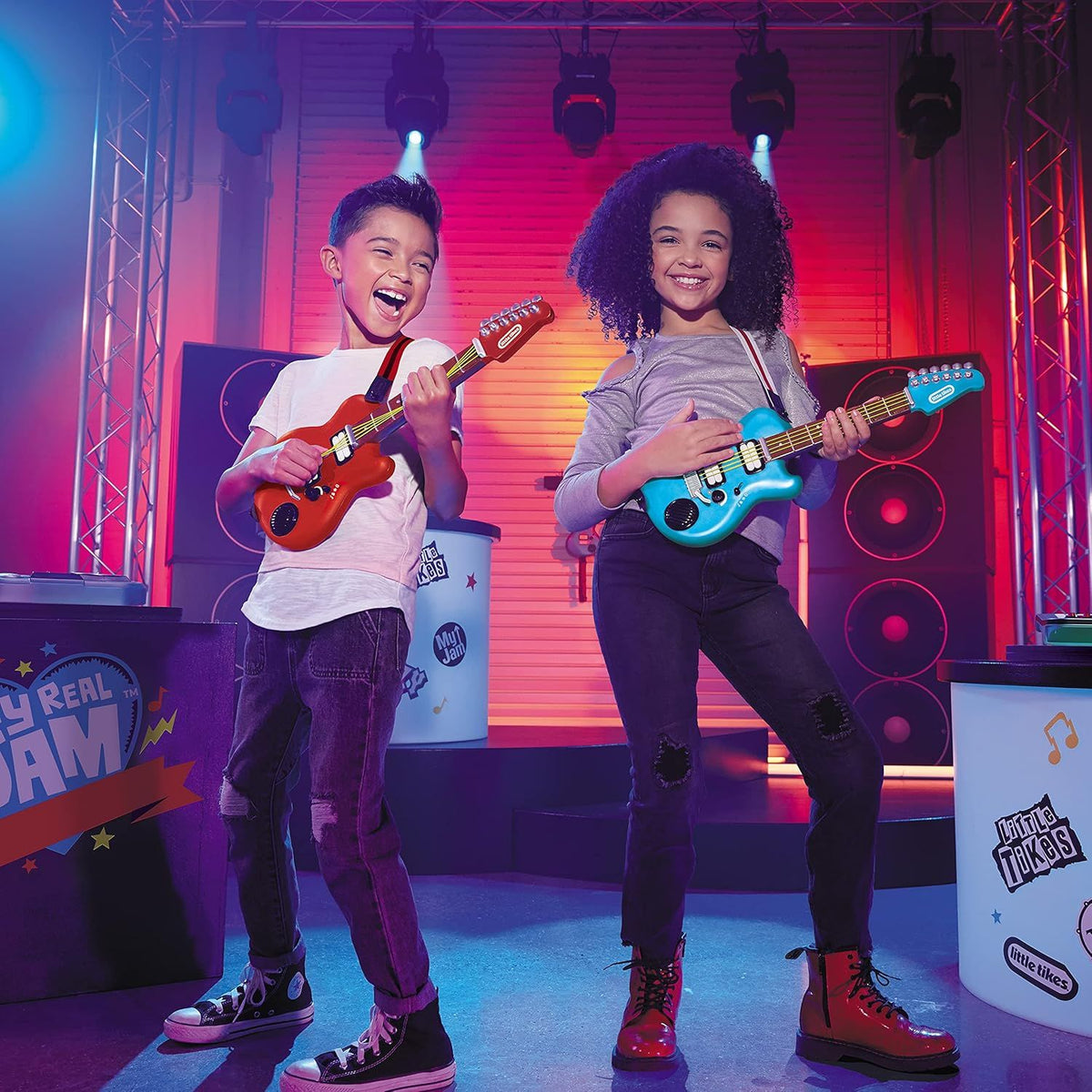 children playing with blue and red mini guitars 