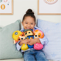 girl holding paw patrol plush 