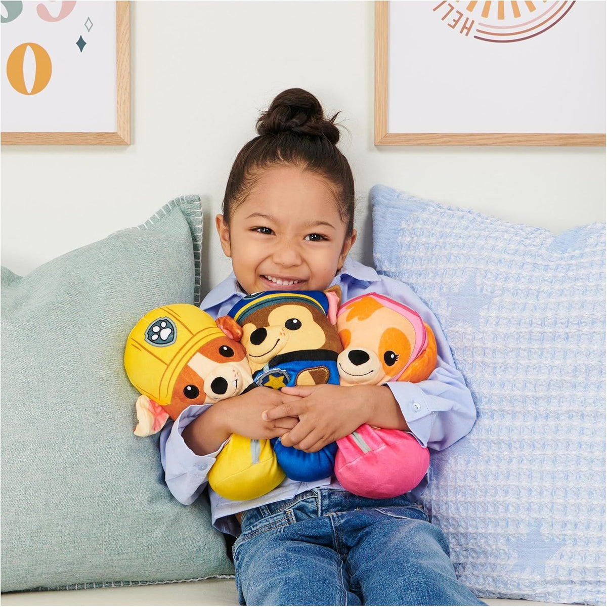 girl holding paw patrol plush 