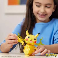 young girl playing with yellow build and show pikachu 