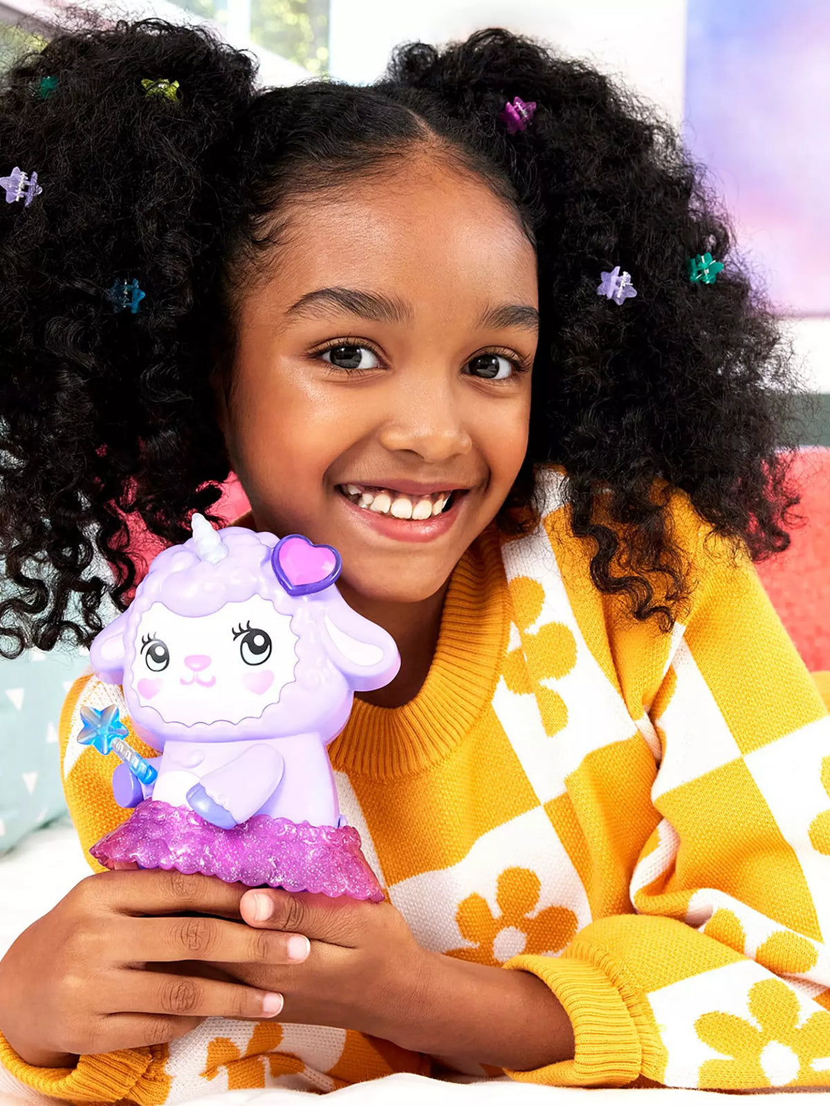 purple lamb compact with accessories inside and girl smiling 