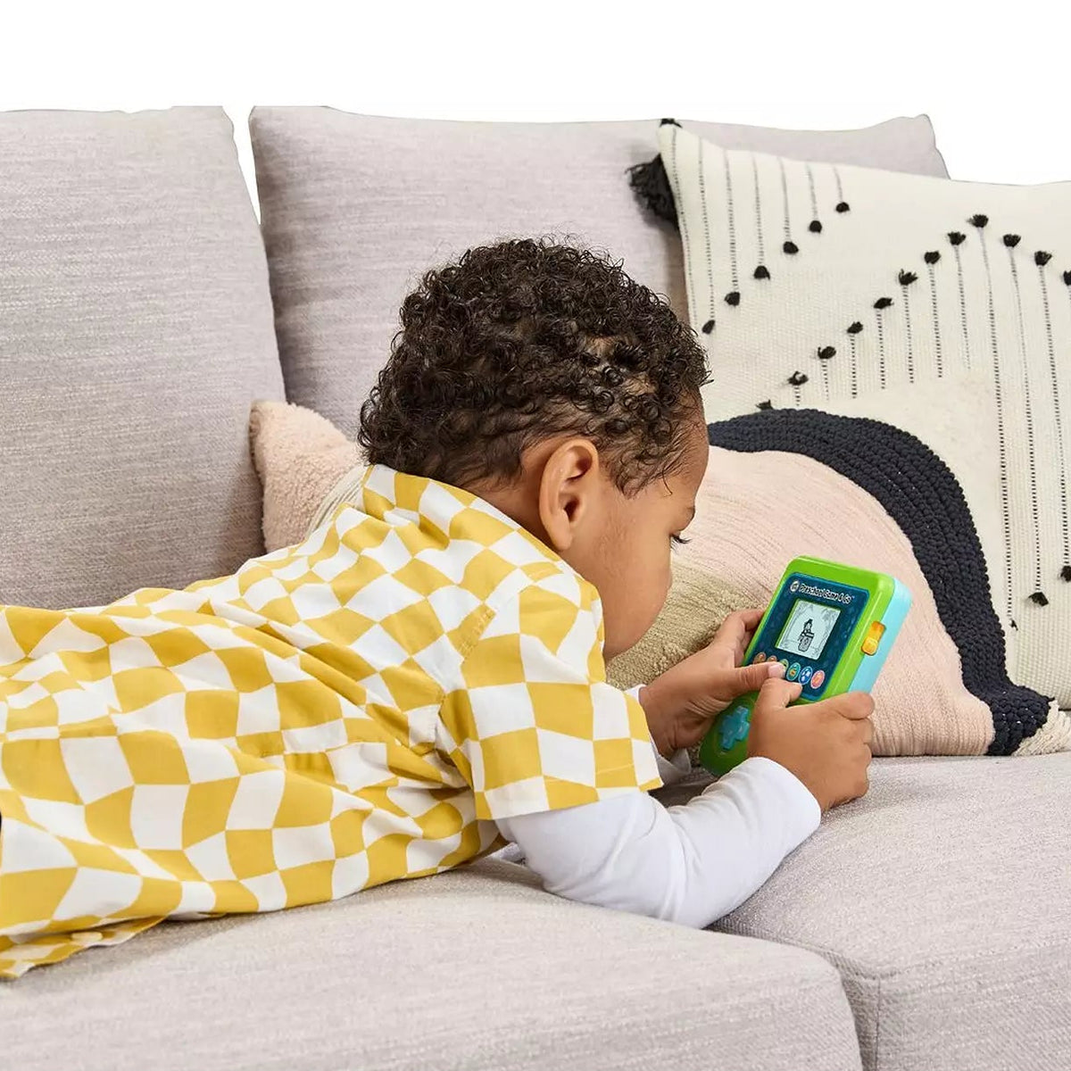 boy playing with preschool gaming console 