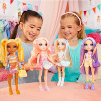 two girls playing with dolls 