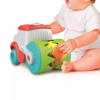 baby playing with sensory road roller 