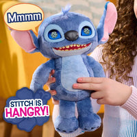 young girl holding light blue plush character with text saying "mmmm" and "stitch is hangry"
