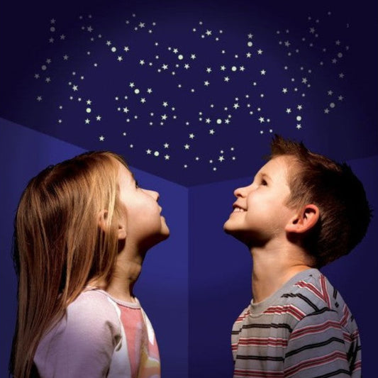 children looking at glow in the dark stars on ceiling 