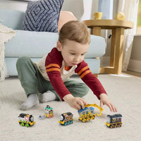 toddler playing with trains 