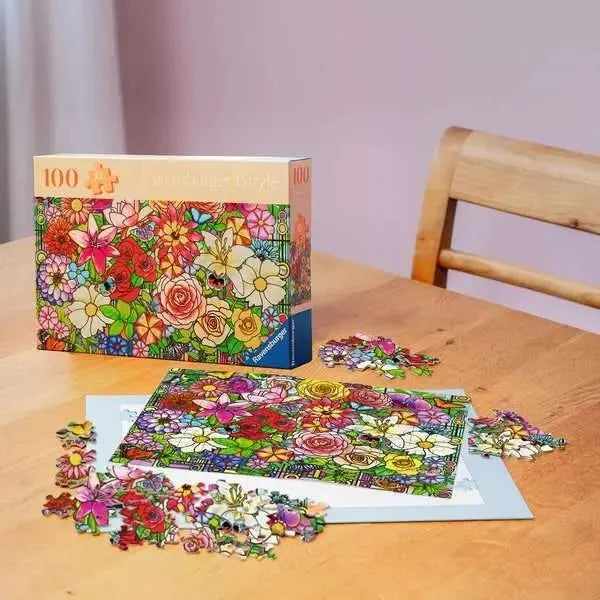 tiffany's flower 100 pc jigsaw puzzle displayed on table with box 