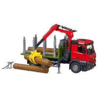 red truck carrying log 