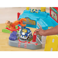 small hand reaching to play with colourful play driver repair set 