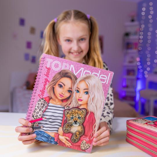 girl holding top model leoheart colouring book 