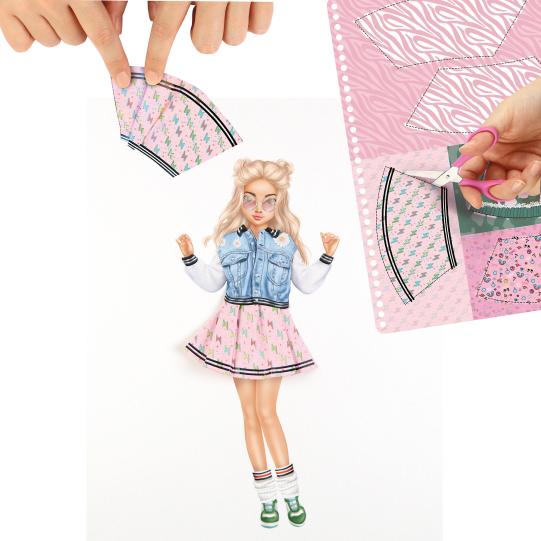 hands making skirt of blank model paper 