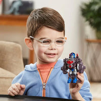 boy playing eith transformers action figure