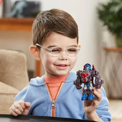 boy playing eith transformers action figure